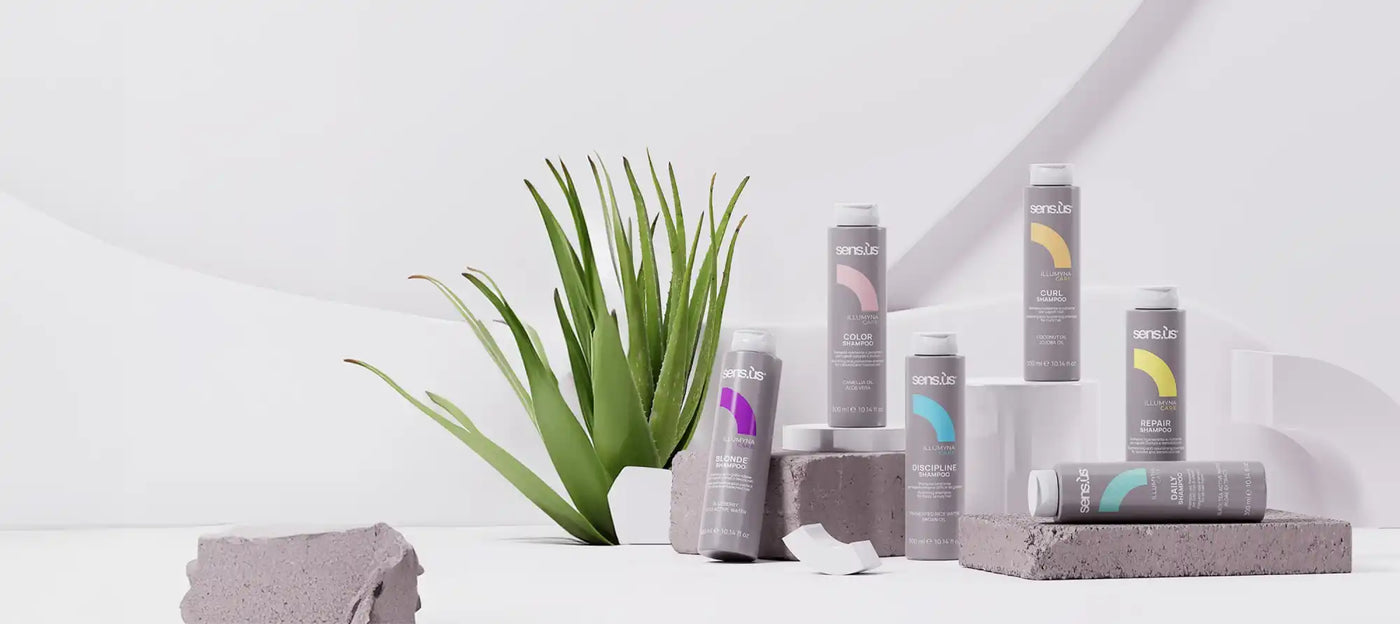 Egy gyűjtemény hajápolási termékekből szürke spray dobozokban színes hangulatjelekkel.