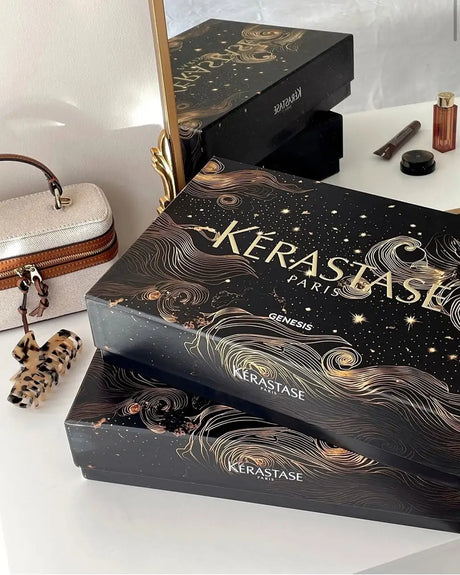 Fekete és arany Kerastase Paris luxus hajápoló dobozkészlet csillagos éjszakai dizájnnal.