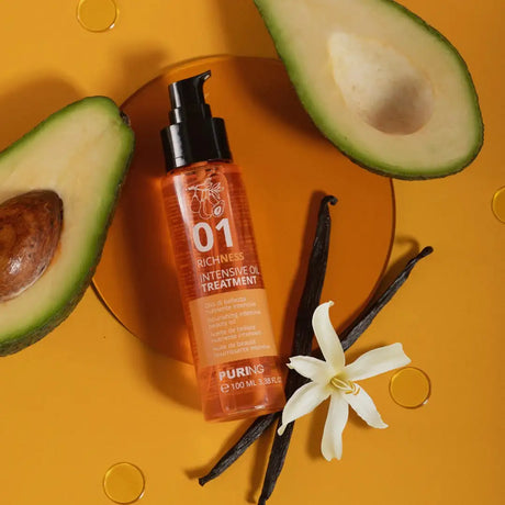 Narancs illatú avokádós hajápoló üveg fekete pumpával és fehér felirattal.