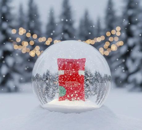 Vörös csomagolás etb max hajeltávolító rugalmas viaszhoz fehér szöveggel és zöld kör alakú dizájnnal.